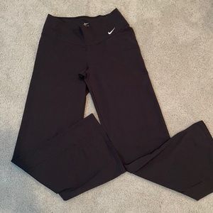 Women’s black Nike wide leg yoga pants.